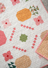Load image into Gallery viewer, "Piña Colada" pineapple quilt by Vanessa Goertzen of Lella Boutique. Fat eighth friendly featuring pineapples, flower, and bold tropical vibes! Fabric is Garden Glam by Lella Boutique for Moda Fabrics (Nov 2026). Download the PDF here!