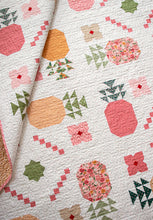 Load image into Gallery viewer, "Piña Colada" pineapple quilt by Vanessa Goertzen of Lella Boutique. Fat eighth friendly featuring pineapples, flower, and bold tropical vibes! Fabric is Garden Glam by Lella Boutique for Moda Fabrics (Nov 2026). Download the PDF here!
