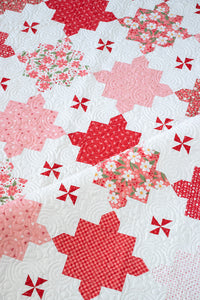 "Sugar 'n Spice" puzzle piece quilt by Vanessa Goertzen of Lella Boutique. Fat quarter friendly - fabric is Love Blooms by Lella Boutique for Moda Fabrics. Download the PDF here.