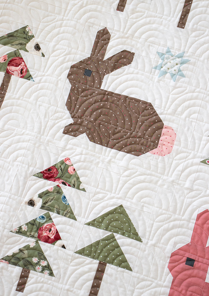 Wild Hare bunny quilt pattern by Vanessa Goertzen of Lella Boutique. Cute pieced rabbit quilt block in a forest of trees. Fat quarter friendly! Fabric is Lovestruck by Lella Boutique for Moda Fabrics.