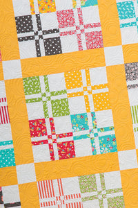 Lickety Split disappearing 4-to-9 patch quilt pattern from the book: Charm School - 18 Quilts from 5" Squares by Vanessa Goertzen of Lella Boutique. Get your autographed copy of the book here! Lots of great charm pack quilts.