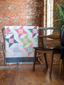 Rock Star friendship star quilt from the book: Charm School - 18 Quilts from 5" Squares by Vanessa Goertzen of Lella Boutique. Get your autographed copy of the book here! Lots of great charm pack quilts. Fabric is Fresh Cut by BasicGrey for Moda Fabrics.