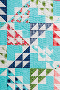 First Crush triangle quilt from the book: Charm School - 18 Quilts from 5" Squares by Vanessa Goertzen of Lella Boutique. Get your autographed copy of the book here! Lots of great charm pack quilts. Fabric is Gooseberry by Lella Boutique for Moda Fabrics.