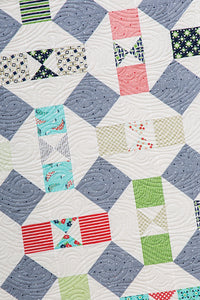 Somersault modern boy quilt from the book: Charm School - 18 Quilts from 5" Squares by Vanessa Goertzen of Lella Boutique. Get your autographed copy of the book here! Lots of great charm pack quilts. Fabric is Daysail by Bonnie & Camille for Moda Fabrics.