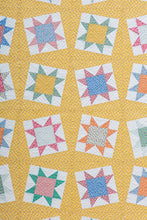Load image into Gallery viewer, Tipsy sawtooth star quilt from the book: Charm School - 18 Quilts from 5&quot; Squares by Vanessa Goertzen of Lella Boutique. Get your autographed copy of the book here! Lots of great charm pack quilts. Fabrics are from the Aunt Grace collections by Judie Rothermel for Marcus Fabrics.