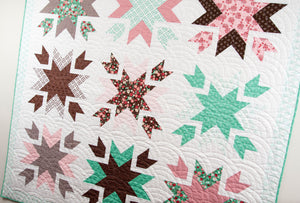 Snow Blossoms star quilt by Lella Boutique for Moda Fabrics. Make it with 9 fat quarters. Fabric is Into the Woods by Lella Boutique for Moda Fabrics.