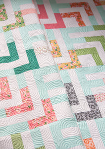 Beachcomber log cabin quilt by Vanessa Goertzen of Lella Boutique. Fun spin on a log cabin design. Make it with a jelly roll or layer cake. Fabric is Sugar Pie by Lella Boutique for Moda Fabrics.