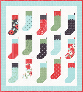 By the Chimney Christmas stocking quilt by Lella Boutique. Fabric is Juniper Berry by BasicGrey for Moda Fabrics.