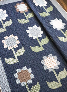 Cottage Blossoms flower quilt by Vanessa Goertzen of Lella Boutique. Make it with a layer cake or fat quarters. Fabric is Harvest Road by Lella Boutique for Moda Fabrics.