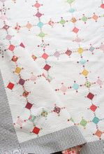 Load image into Gallery viewer, Diamond Dust diamond quilt in Lollipop Garden fabric by Lella Boutique. Make it with charm packs, mini charm packs, or scraps. Download the pattern here!