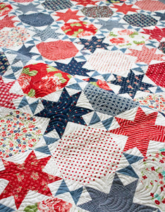 Starstruck 2 beautiful bursting star quilt featuring sawtooth stars. Fat quarter quilt or layer cake quilt. Fabric is Early Bird by Bonnie & Camille for Moda Fabrics. Makes a great 4th of July quilt!