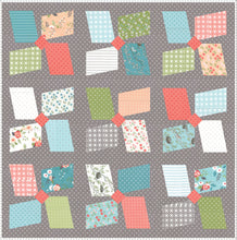 Load image into Gallery viewer, Easy Breezy large pinwheel quilt. Layer Cake friendly. Fabric is Nest by Lella Boutique for Moda Fabrics.