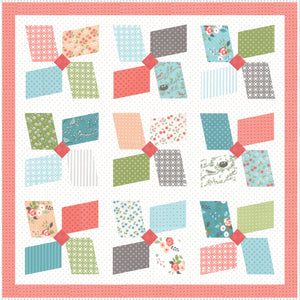 Easy Breezy large pinwheel quilt by Lella Boutique. Layer Cake friendly. Fabric is Nest by Lella Boutique for Moda Fabrics.
