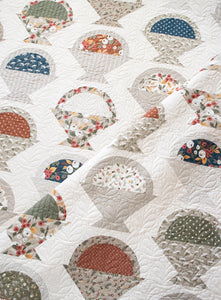 Gather basket quilt pattern by Lella Boutique. Make it with a Layer Cake, Jolly Bar, fat eighths, or scraps. Fabric is Flower Pot by Lella Boutique for Moda Fabrics.