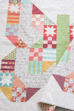 Load image into Gallery viewer, Butterfly Patch - scrappy patchwork butterfly quilt by Lella Boutique. Beginner level sampler made with a Layer Cake (precut 10&quot; squares). Fabric is Lollipop Garden by Lella Boutique for Moda Fabrics. Download the PDF here!
