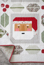 Load image into Gallery viewer, St. Nick Santa quilt by Vanessa Goertzen of Lella Boutique. Traditionally pieced Santa block framed with holly and berry quilt blocks. Make it with a Jelly Roll or Layer Cake. Fabric is Christmas Eve by Lella Boutique for Moda Fabrics.