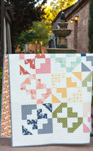 June Bug beginner quilt pattern by Lella Boutique. Make it with a layer cake or fat quarters. Fabric is Little Miss Sunshine by Lella Boutique for Moda Fabrics.