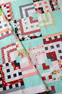 In the Mix scrappy log cabin quilt from the book: Jelly Filled - 18 Quilts from 2-1/2" Strips by Vanessa Goertzen of Lella Boutique. Get your autographed copy of the book here! Lots of great jelly roll strip quilts. Fabric is Bonnie & Camille for Moda Fabrics.