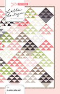 Homestead triangle quilt by Vanessa Goertzen of Lella Boutique. Layer Cake friendly. Fabric is Olive's Flower Market by Lella Boutique for Moda Fabrics.