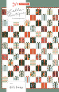 Gift Swap charm pack quilt by Lella Boutique. Cute Christmas present quilt in Holiday Classics fabric by Rifle Paper Co. for Cotton + Steel. Make it with charm packs, fat quarters, or scraps.