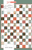 Gift Swap charm pack quilt by Lella Boutique. Cute Christmas present quilt in Holiday Classics fabric by Rifle Paper Co. for Cotton + Steel. Make it with charm packs, fat quarters, or scraps.
