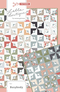Busybody pinwheel quilt pattern by Lella Boutique. Make it with 1 Jelly Roll or 1 Layer Cake. Fabric is Country Rose by Lella Boutique for Moda Fabrics. Beginner friendly!