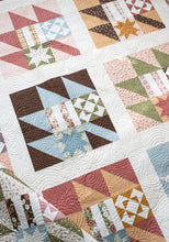 Load image into Gallery viewer, New Leaf scrappy leaf sampler quilt made with a Layer Cake. Fabric is Folktale by Lella Boutiquque for Moda Fabrics.
