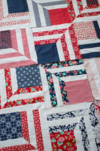 Load image into Gallery viewer, &quot;Fracture&quot; modern log cabin quilt. Fat eighth quilt. Great 4th of July quilt. Fabric is  red and navy prints by Bonnie &amp; Camille for Moda.