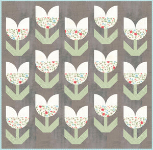 "Holland" tulip quilt by Lella Boutique. Beginner curved piecing to make simple tulip blocks. Fabric is Garden Variety by Lella Boutique for Moda Fabrics.