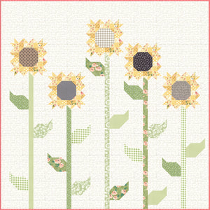 Scrappy sunflower quilt by Lella Boutique. Fabric is Farmer's Daughter by Lella Boutique for Moda Fabrics.