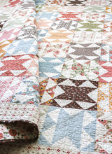 Load image into Gallery viewer, Chatterbox geometric quilt by Vanessa Goertzen of Lella Boutique. Jelly Roll or Layer Cake friendly. Fabric is Folktale by Lella Boutique for Moda Fabrics.