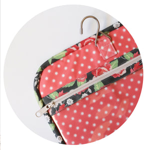 "Kiss & Makeup" hanging travel bag pattern by Lella Boutique. Great sewing pattern for a toiletry bag. Fabric is Bloomington by Lella Boutique for Moda Fabrics.