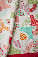 Load image into Gallery viewer, Dishes curved block quilt by Lella Boutique. Layer Cake quilt. Beginner friendly intro to curved piecing. Fabric is Hello Darling by Bonnie &amp; Camille for Moda Fabrics.