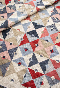 Double Dutch geometric triangle quilt by Lella Boutique. Make it with fat quarters or fat eighths. Fabric is Sweet Tea by Sweetwater for Moda Fabrics. Download the PDF here!