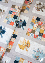 Load image into Gallery viewer, Leaves of Change scrappy leaf quilt pattern by Lella Boutique. Make it with a Jelly Roll (2.5&quot; strips). Fabric is Persimmon by BasicGrey for Moda (but would also look great in their new Cider collection).
