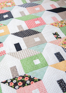 Home Again overlapping house quilt by Vanessa Goertzen. Fabric is Farmer's Daughter by Lella Boutique for Moda Fabrics.