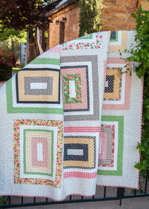 Kith & Kin jelly roll rectangle quilt. Cute farmhouse style quilt. Fabric is Farmer's Daughter by Lella Boutique for Moda Fabrics.