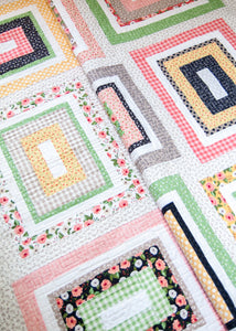 Kith and Kin jelly roll rectangle quilt. Cute farmhouse style quilt.Fabric is Farmer's Daughter by Lella Boutique for Moda Fabrics.