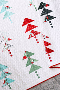 "Forest" scrappy tree quilt by Lella Boutique. Make the scrappy tree quilt blocks with charm packs. Fabric is Little Tree by Lella Boutique for Moda. Download the PDF here!
