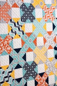 Hot Cross Buns plus sign quilt by Vanessa Goertzen of Lella Boutique. Make it with a Jelly Roll or Layer Cake. Fabric is Mixologie by Studio M for Moda Fabrics. Great boy quilt!