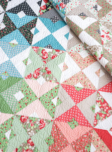 Double Dutch geometric triangle quilt by Lella Boutique. Make it with fat quarters or fat eighths. Fabric is Bloomington by Lella Boutique for Moda Fabrics.