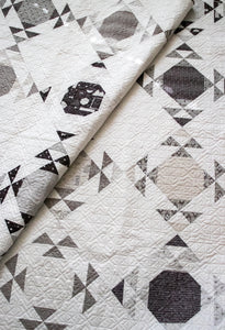 Moonwake geometric fat quarter quilt by Lella Boutique. Cool triangle design in Smoke & Rust fabric. Modern meets traditional quilt depending on fabric choices. Would make a good boy quilt! Download the pattern here.