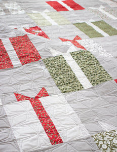 Nice List simple gift quilt by Lella Boutique. Layer Cake quilt. Cute Christmas present quilt blocks are in Christmas Morning fabric by Lella Boutique. Download the PDF here.