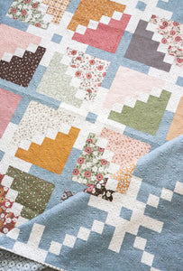 Sparkler star quilt by Lella Boutique. Layer Cake quilt. Fabric is Folktale by Lella Boutique for Moda Fabrics. Download the PDF here!