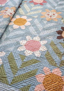 "Spring Fling" geometric flower quilt. Fat quarter quilt. Fabric is Folktale by Lella Boutique for Moda Fabrics.