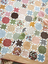 Load image into Gallery viewer, Starstruck 2 bursting star quilt featuring sawtooth star blocks. Layer Cake quilt or fat quarter quilt. Fabric is Folktale by Lella Boutique for Moda. Download the PDF here!